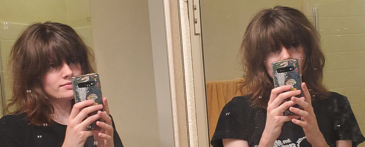 Me with a shag with bangs. This was the first time I ever cut my own hair.