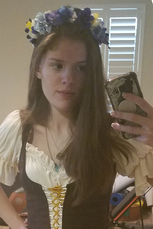 Me with my long hair in a renfaire outfit.