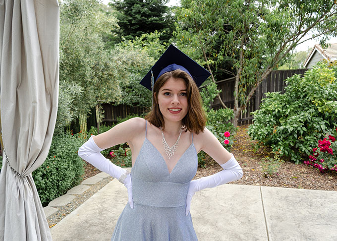 Me in my graduation cap and what would have been my senior ball gown.